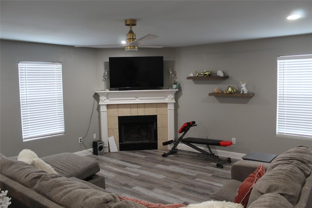 12824 Kingsgate Dr, Rhome, TX 76078 - living room with a ceiling fan, recessed lighting, wood finished floors, a tile fireplace, and baseboards