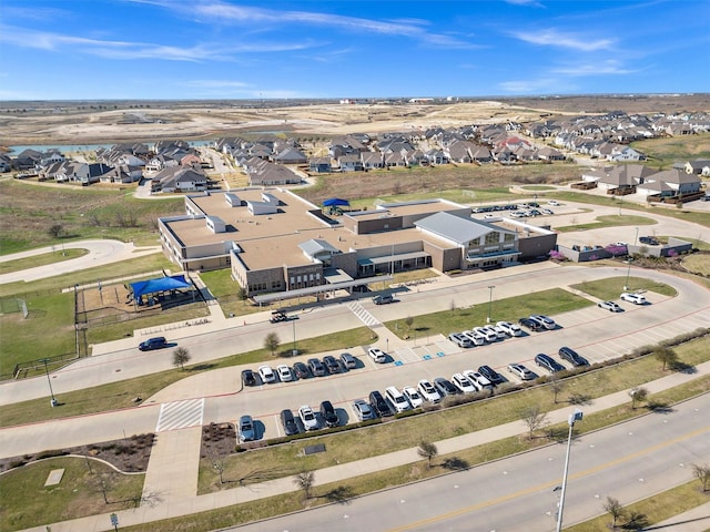 birds eye view of property with a residential view