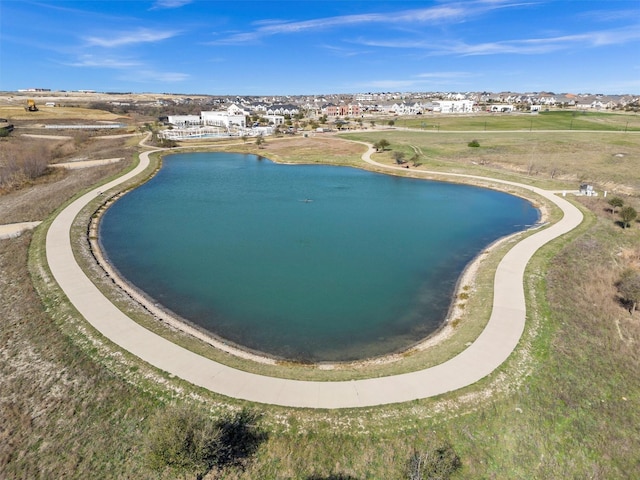 drone / aerial view featuring a water view and a residential view