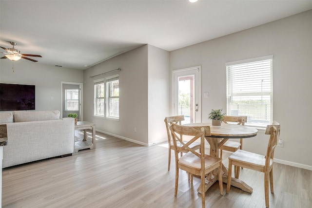 628 Bronze Forest Dr, Fort Worth, TX 76131 - dining room featuring light wood-type flooring, baseboards, and a ceiling fan