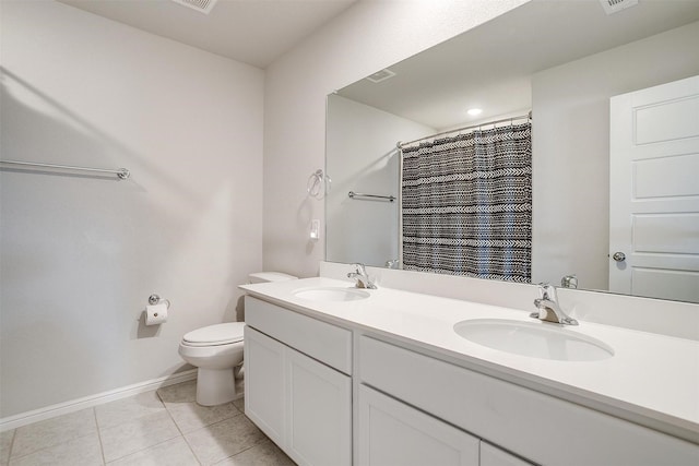 628 Bronze Forest Dr, Fort Worth, TX 76131 - bathroom featuring toilet, double vanity, tile patterned floors, and baseboards