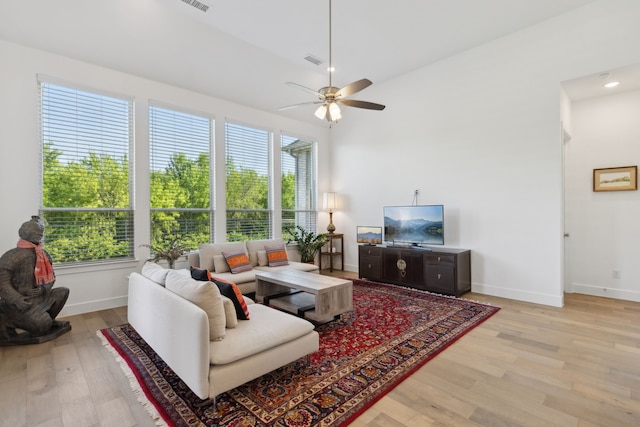 808 Bluestem Dr, Aubrey, TX 76227 - living area featuring ceiling fan, baseboards, and light wood-type flooring