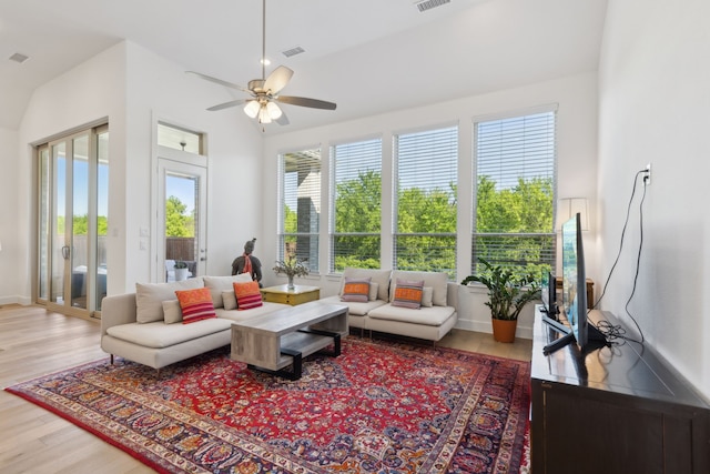 808 Bluestem Dr, Aubrey, TX 76227 - living room featuring wood finished floors, ceiling fan, and baseboards