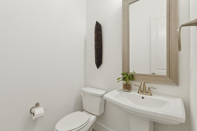 808 Bluestem Dr, Aubrey, TX 76227 - half bath featuring toilet, baseboards, and a sink