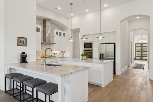 808 Bluestem Dr, Aubrey, TX 76227 - kitchen featuring appliances with stainless steel finishes, a peninsula, backsplash, white cabinetry, and recessed lighting