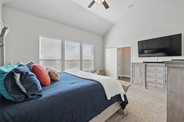 bedroom featuring a ceiling fan, visible vents, lofted ceiling, and carpet floors