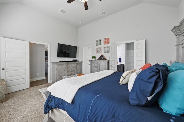 bedroom with visible vents, high vaulted ceiling, and carpet flooring