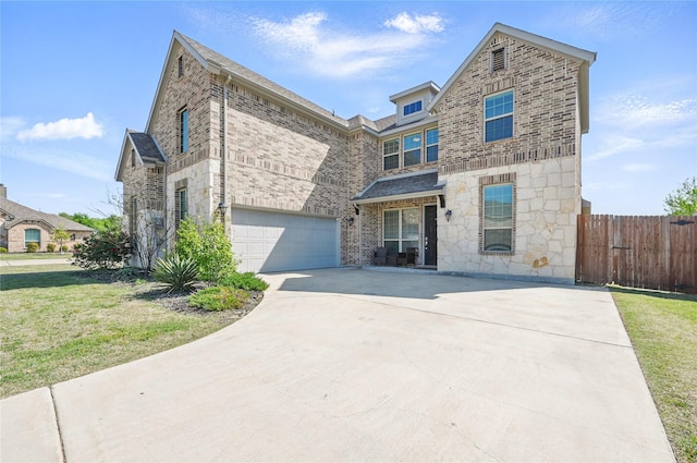 view of front of property with a garage, driveway, stone siding, brick siding, and fence