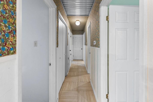 3014 Jennifer Ave, Denison, TX 75020 - corridor featuring wallpapered walls and a wainscoted wall