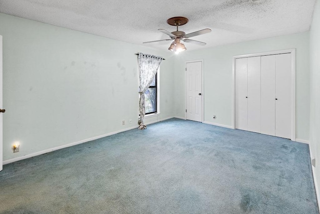 3014 Jennifer Ave, Denison, TX 75020 - unfurnished bedroom with ceiling fan, carpet, a textured ceiling, multiple closets, and baseboards