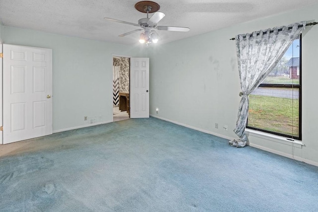 3014 Jennifer Ave, Denison, TX 75020 - spare room with carpet flooring, a textured ceiling, baseboards, and ceiling fan