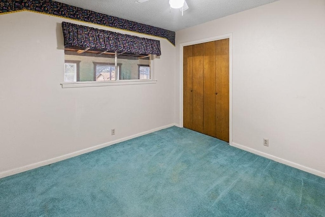 3014 Jennifer Ave, Denison, TX 75020 - unfurnished bedroom with carpet, a textured ceiling, baseboards, and ceiling fan