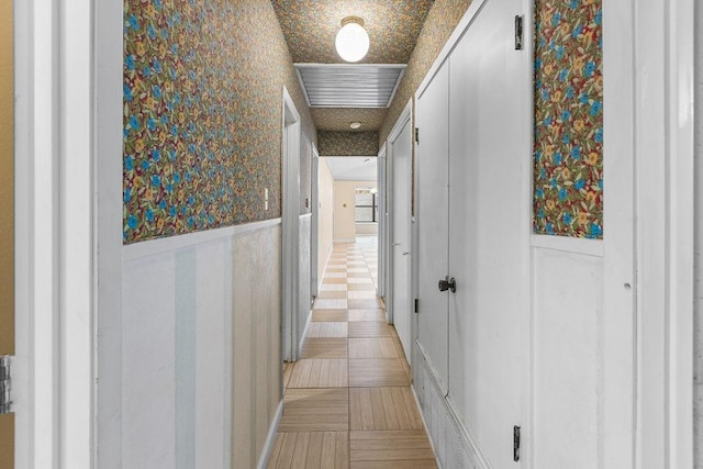 3014 Jennifer Ave, Denison, TX 75020 - hall featuring wallpapered walls and wainscoting