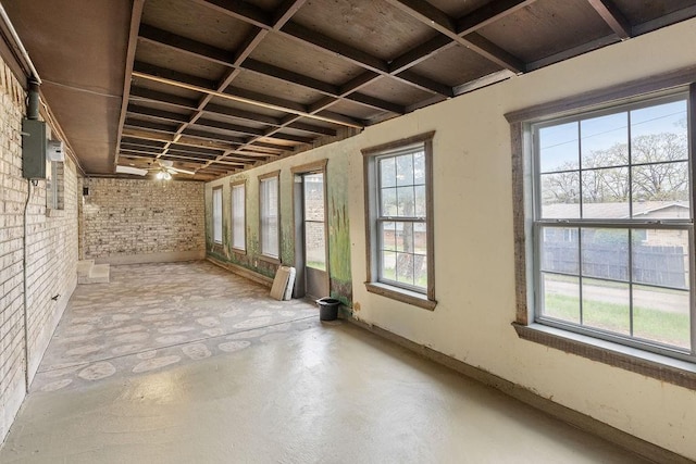 3014 Jennifer Ave, Denison, TX 75020 - interior space featuring brick wall and concrete flooring
