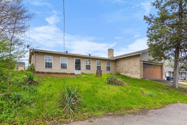 3014 Jennifer Ave, Denison, TX 75020 - single story home featuring driveway, a chimney, and an attached garage