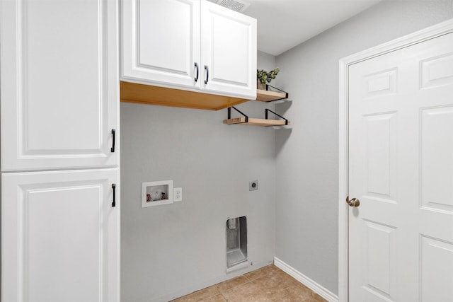 laundry room with light tile patterned floors, electric dryer hookup, washer hookup, baseboards, and cabinet space