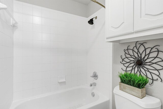 full bathroom with toilet and  shower combination