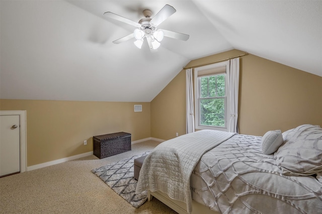 carpeted bedroom with lofted ceiling, visible vents, a ceiling fan, and baseboards
