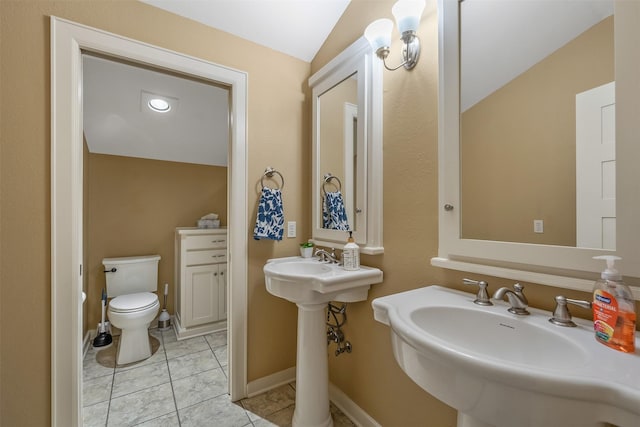 bathroom featuring toilet and lofted ceiling