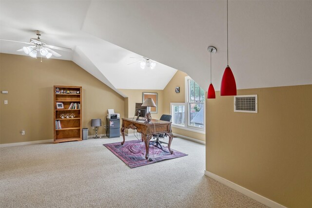 carpeted office space with ceiling fan, lofted ceiling, visible vents, and baseboards