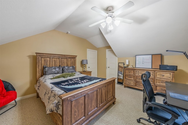 bedroom with lofted ceiling, a ceiling fan, baseboards, and light colored carpet