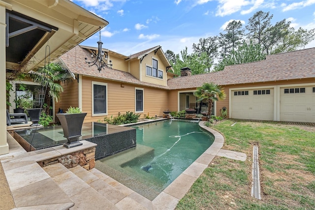 outdoor pool featuring a yard