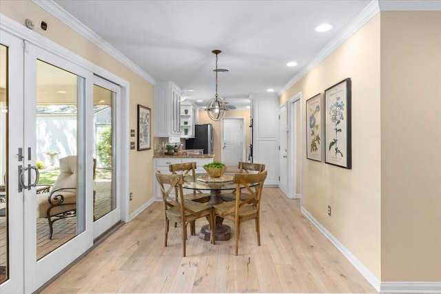 dining room with light wood-type flooring, baseboards, recessed lighting, ornamental molding, and french doors
