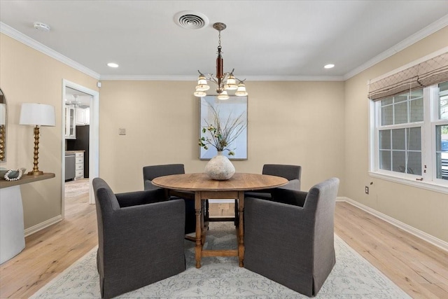 dining area with crown molding, a chandelier, wood finished floors, baseboards, and recessed lighting
