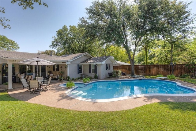 view of swimming pool with a patio area and a pool with connected hot tub
