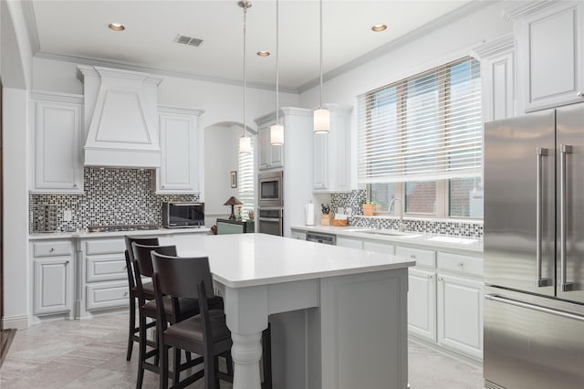 4020 Angelina Dr, Mckinney, TX 75071 - kitchen with appliances with stainless steel finishes, a sink, light countertops, backsplash, and ornamental molding