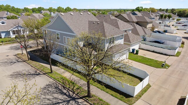 birds eye view of property with a residential view