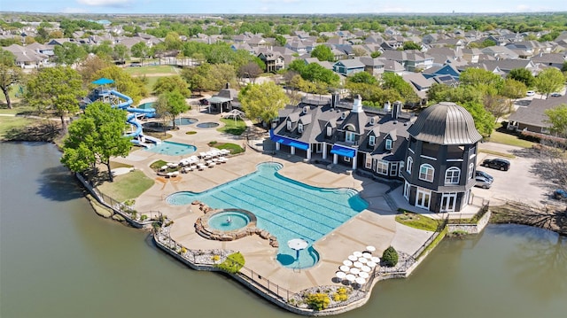 aerial view featuring a water view and a residential view