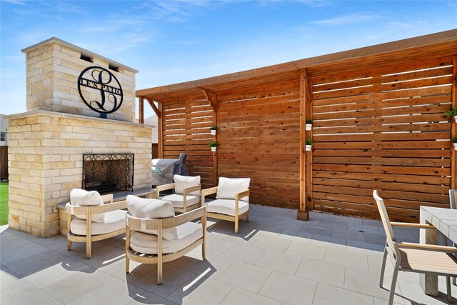 801 Ivy Glen Ct, Prosper, TX 75078 - view of patio with an outdoor living space with a fireplace and fence