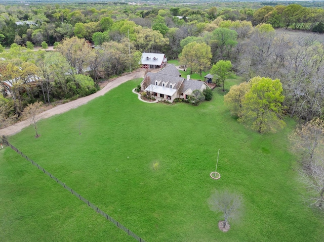 aerial view featuring a wooded view