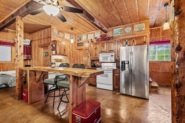 kitchen featuring butcher block countertops, wood ceiling, wooden walls, and white appliances