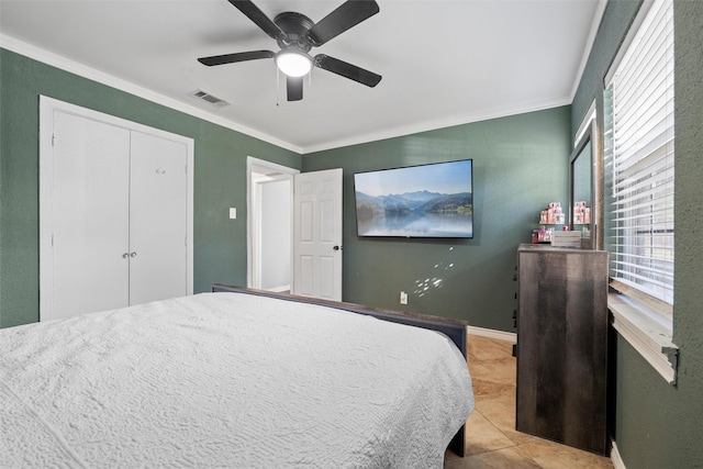 tiled bedroom featuring ornamental molding, a ceiling fan, and visible vents