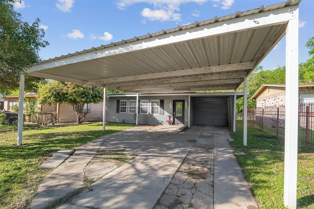 exterior space featuring driveway, an attached garage, and fence