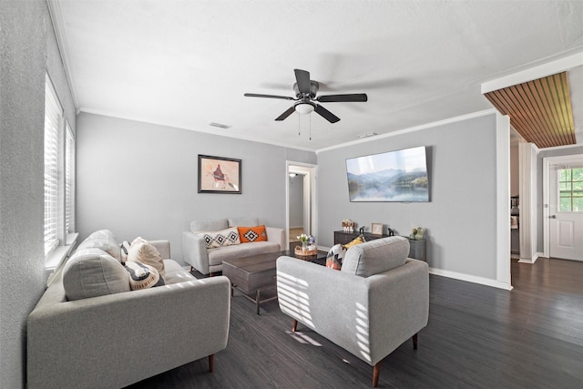 living room featuring a ceiling fan, visible vents, baseboards, and dark wood-type flooring