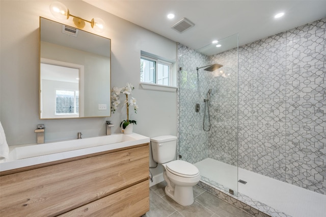 full bath featuring tile patterned flooring, visible vents, walk in shower, and toilet