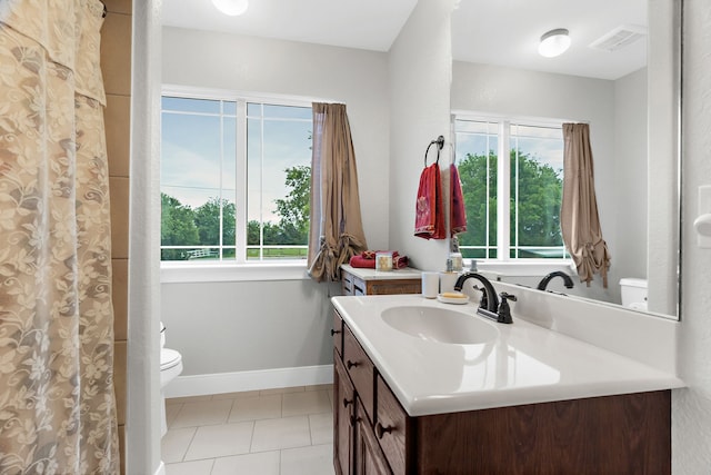 bathroom with visible vents, tile patterned floors, vanity, and toilet