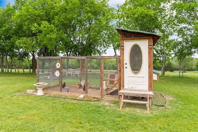 view of poultry coop with a yard