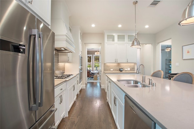 2208 Tremont Blvd, Mckinney, TX 75071 - kitchen featuring stainless steel appliances, a sink, dark wood-style floors, recessed lighting, and backsplash