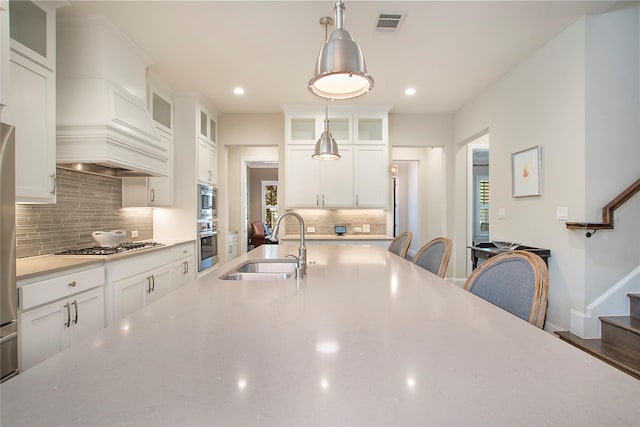 2208 Tremont Blvd, Mckinney, TX 75071 - kitchen featuring a sink, appliances with stainless steel finishes, recessed lighting, decorative backsplash, and decorative light fixtures