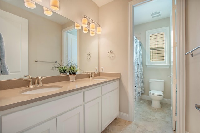 2208 Tremont Blvd, Mckinney, TX 75071 - bathroom with toilet, double vanity, a shower with curtain, tile patterned flooring, and baseboards