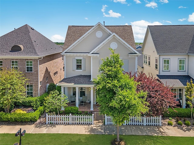 2208 Tremont Blvd, Mckinney, TX 75071 - traditional-style home featuring covered porch and a shingled roof