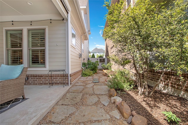 2208 Tremont Blvd, Mckinney, TX 75071 - view of side of property with brick siding, fence, and a patio