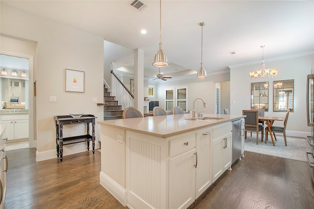 2208 Tremont Blvd, Mckinney, TX 75071 - kitchen with a sink, stainless steel dishwasher, a ceiling fan, dark wood finished floors, and a chandelier