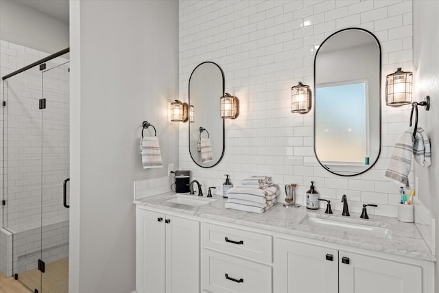 full bath with a shower stall, decorative backsplash, and a sink