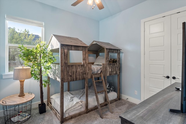 carpeted bedroom with baseboards