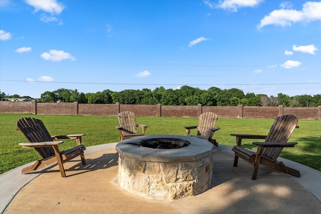 view of patio / terrace featuring an outdoor fire pit and fence